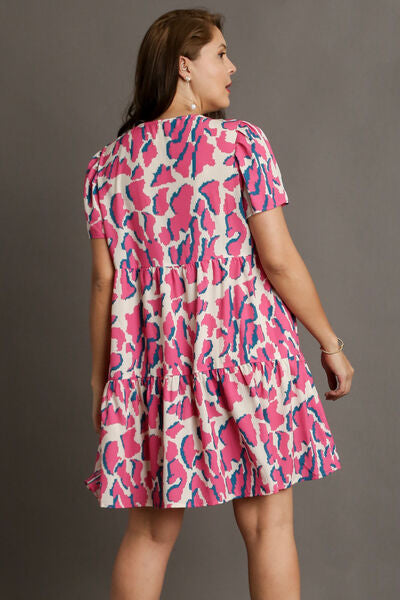 Full Size Abstract Print Pleat Detail Short Sleeve V-Neck Tiered Dress Plus Size