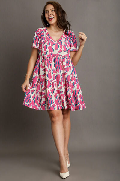 Full Size Abstract Print Pleat Detail Short Sleeve V-Neck Tiered Dress Plus Size