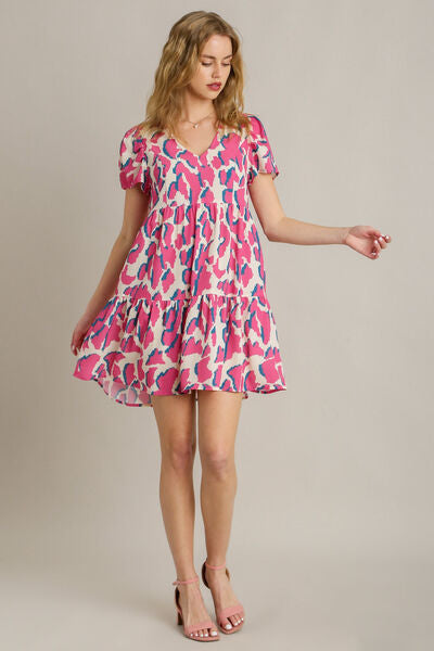 Full Size Abstract Print Pleat Detail Short Sleeve V-Neck Tiered Dress Plus Size