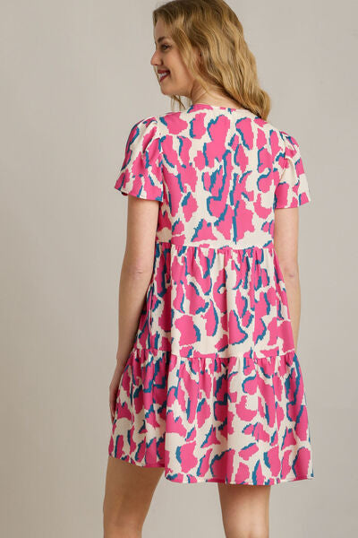 Full Size Abstract Print Pleat Detail Short Sleeve V-Neck Tiered Dress Plus Size